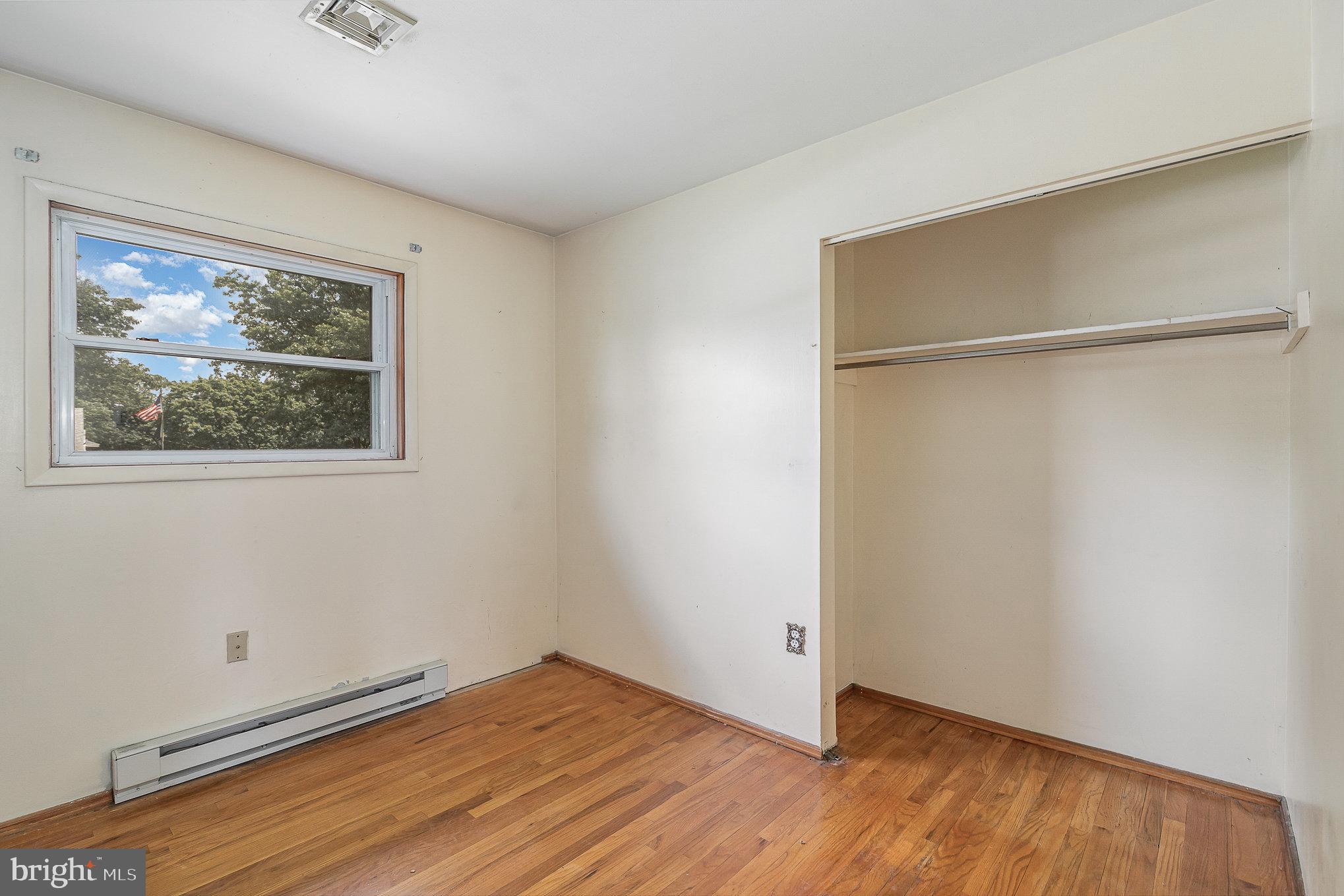 1955 Dawn Road Enola, PA 17025 - Photo 10 of 21 a view of an empty room with wooden floor and a window