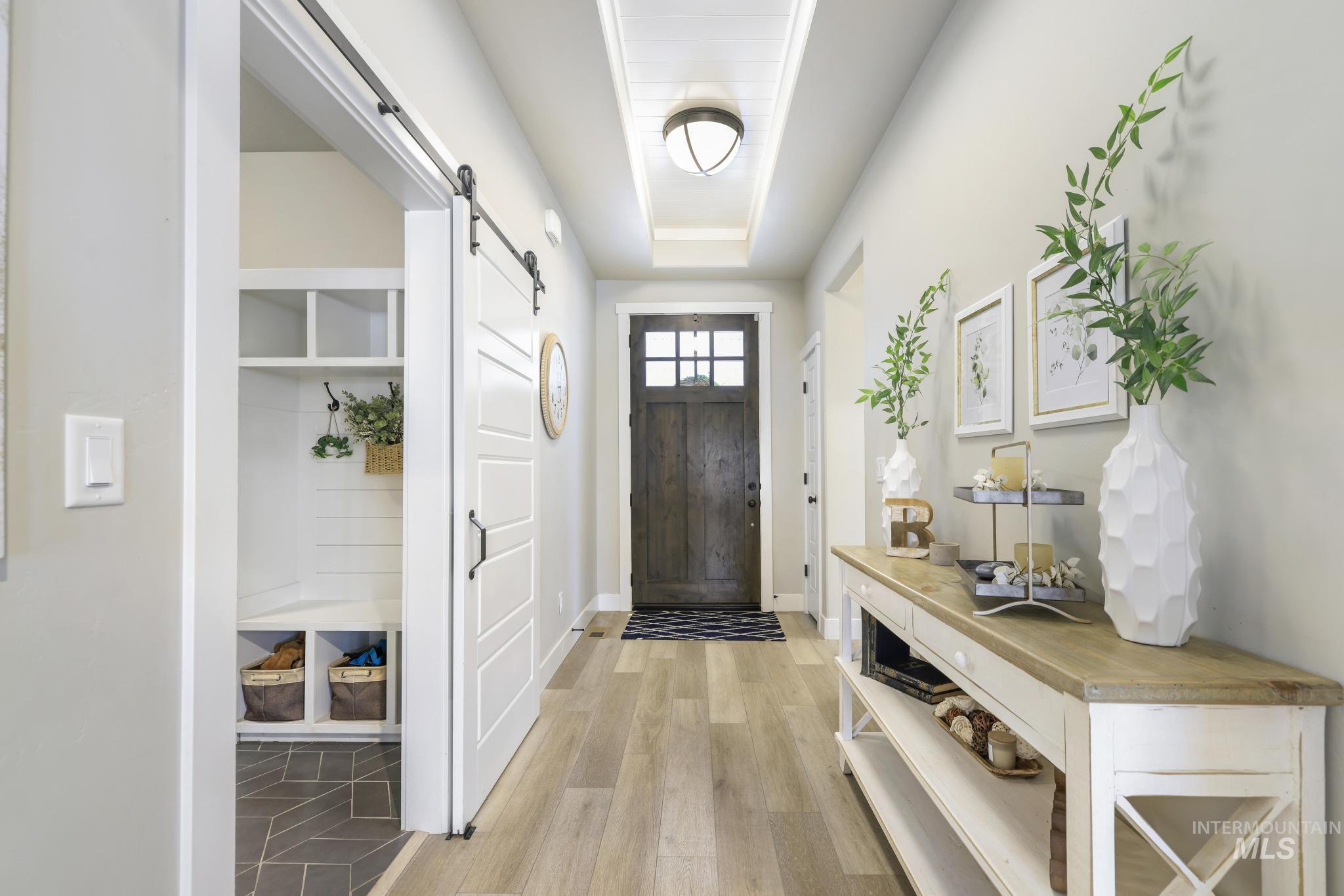 3103 Moonrise Road Twin Falls, ID 83301 - Photo 2 of 40 Entryway with a barn door and light wood-type flooring