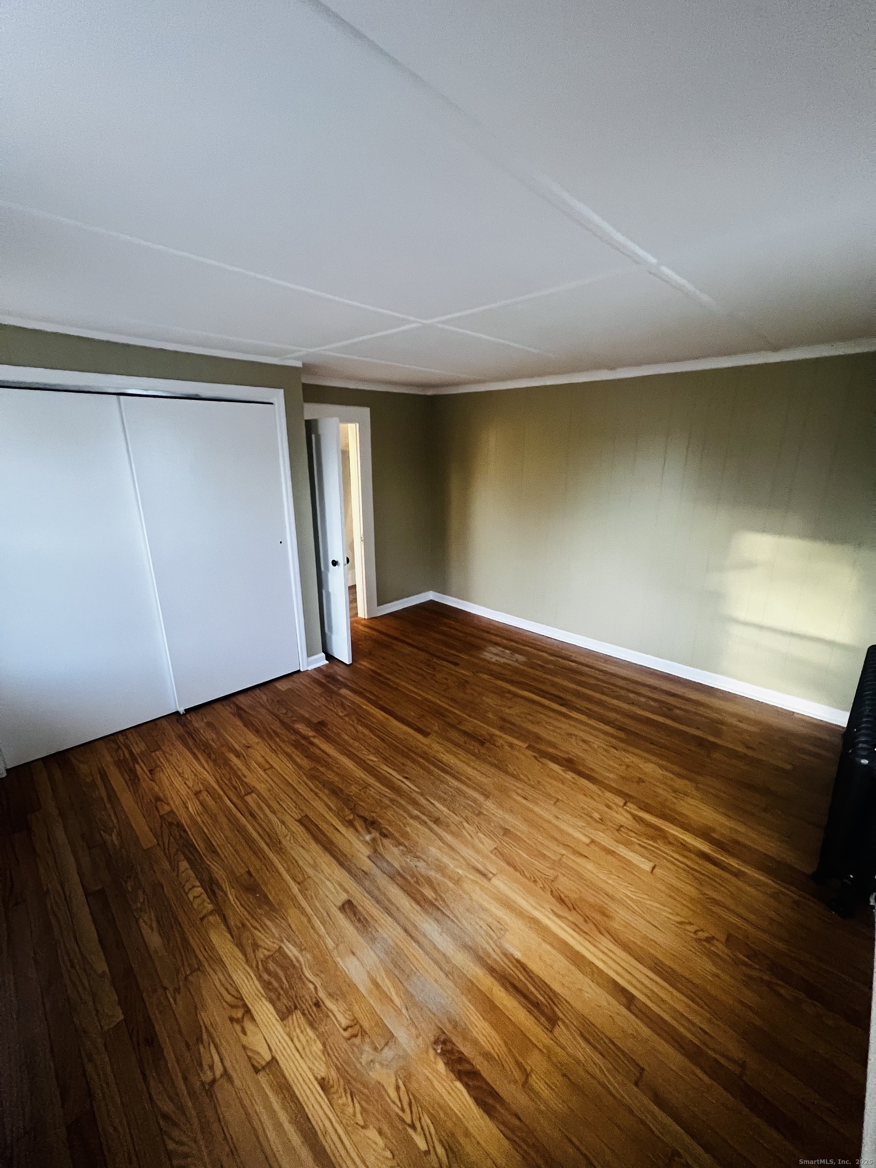 20 Lee Avenue, Unit 2 Wallingford, CT 06492 - Photo 12 of 21 a view of empty room with wooden floor