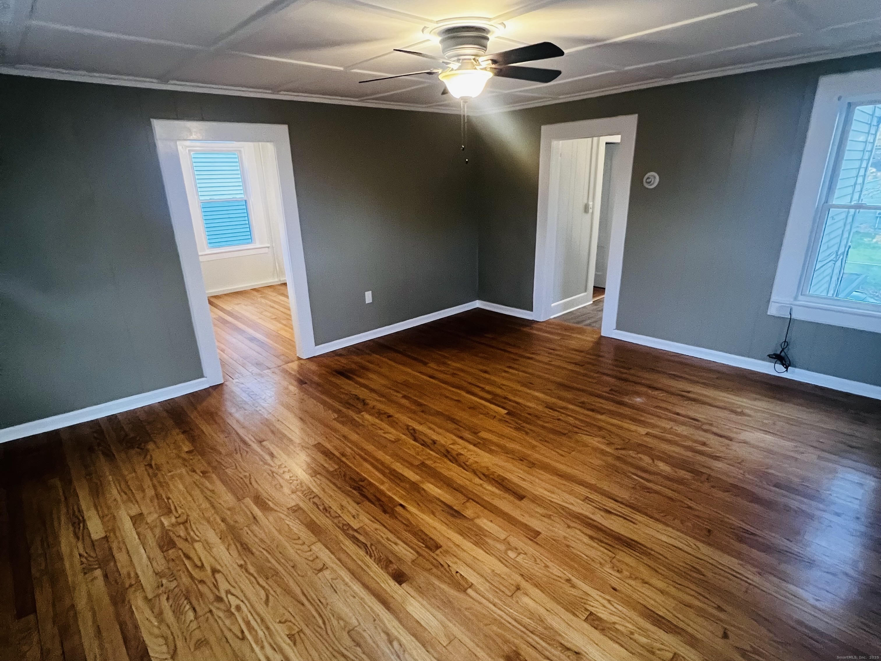 20 Lee Avenue, Unit 2 Wallingford, CT 06492 - Photo 6 of 21 a view of an empty room with wooden floor and a window