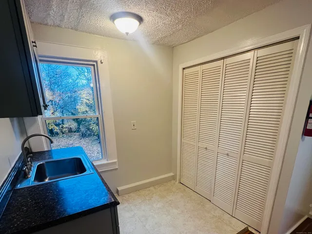 wooden floor in a bathroom next to a window