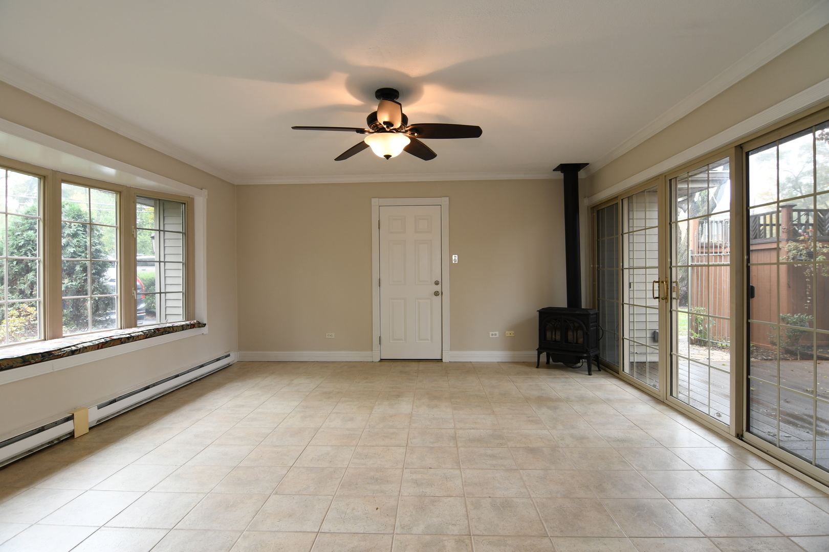 909 Warrenville Road Wheaton, IL 60189 - Photo 7 of 22 a view of an empty room with a window