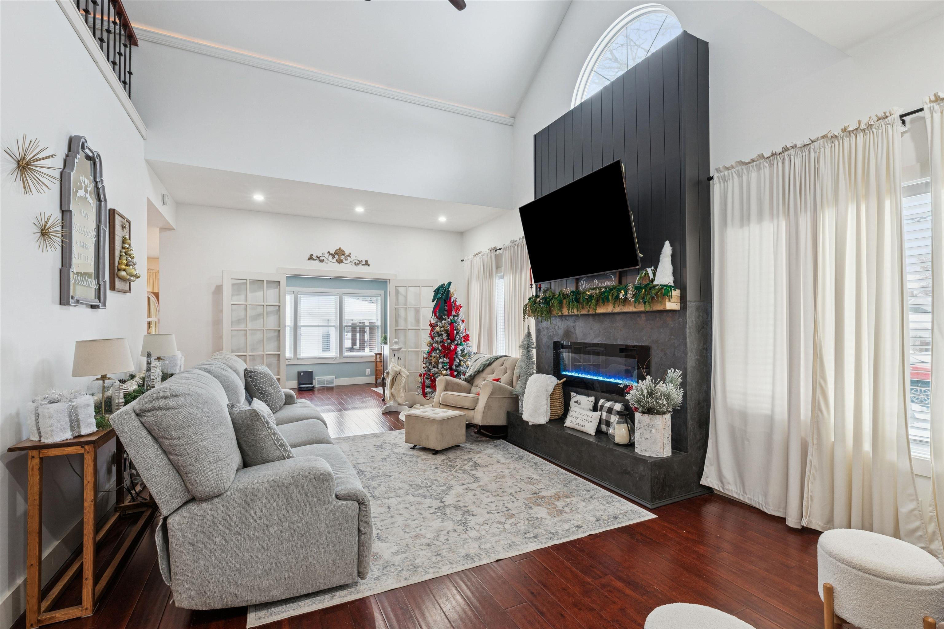 306 North Main Street Alexis, IL 61412 - Photo 12 of 44 a living room with furniture a fireplace and a flat screen tv