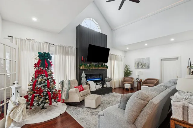 a living room with furniture and a christmas tree