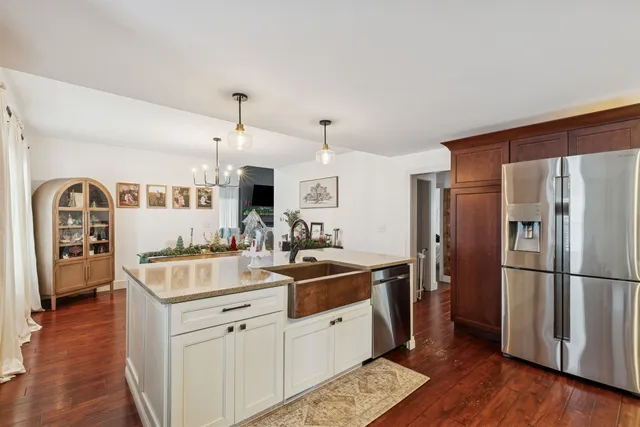 a kitchen with a sink and refrigerator