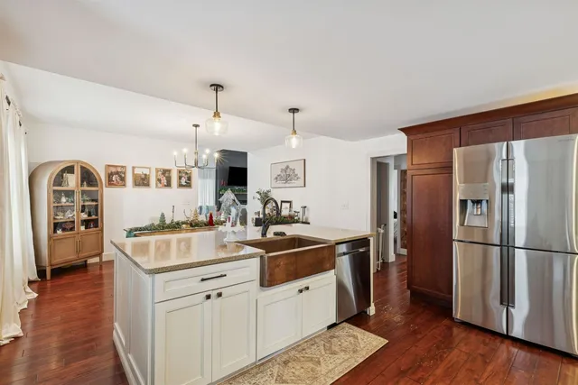a kitchen with a sink and refrigerator