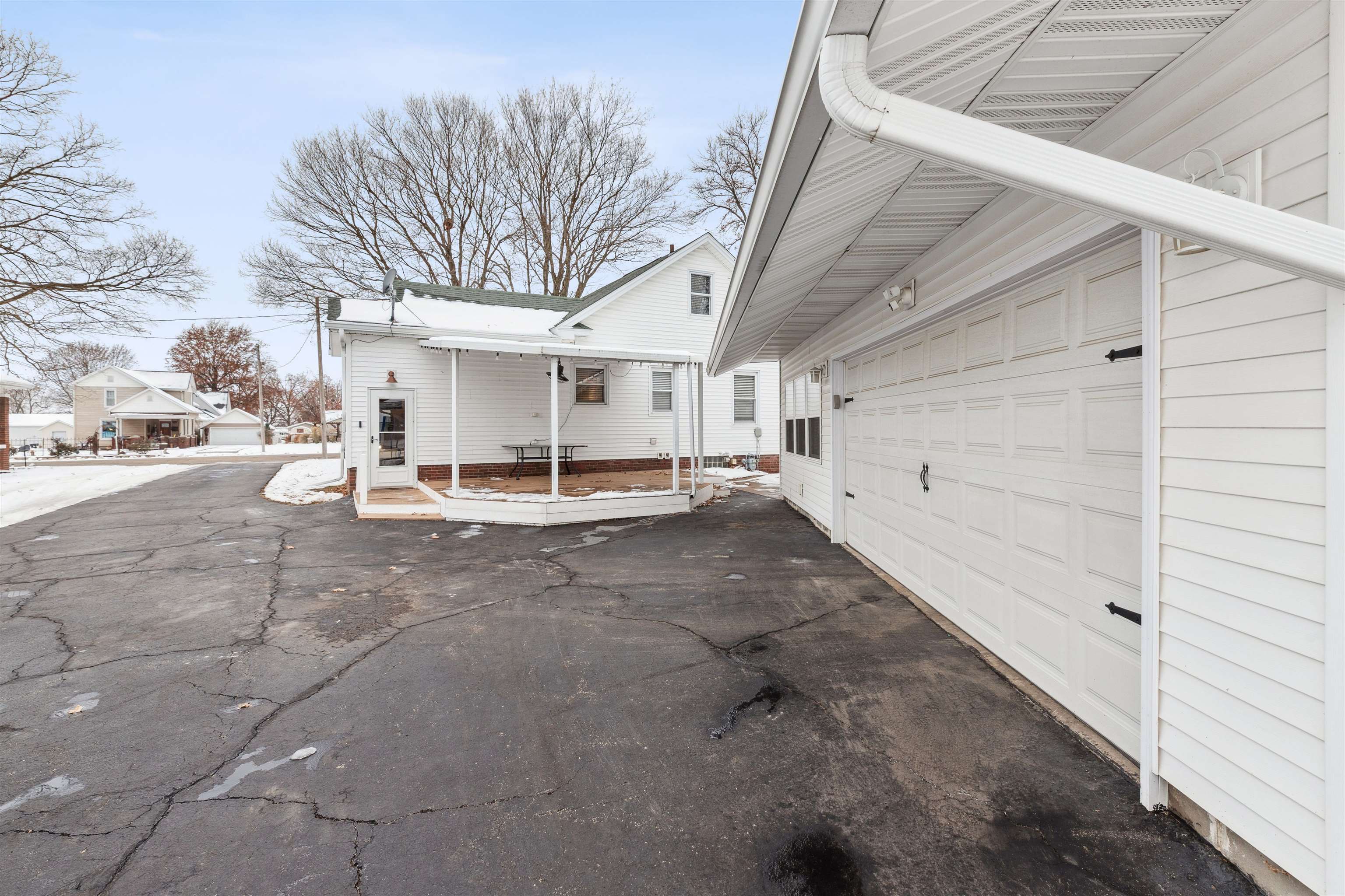 306 North Main Street Alexis, IL 61412 - Photo 7 of 44 a view of a patio with table and chairs and floor to ceiling window