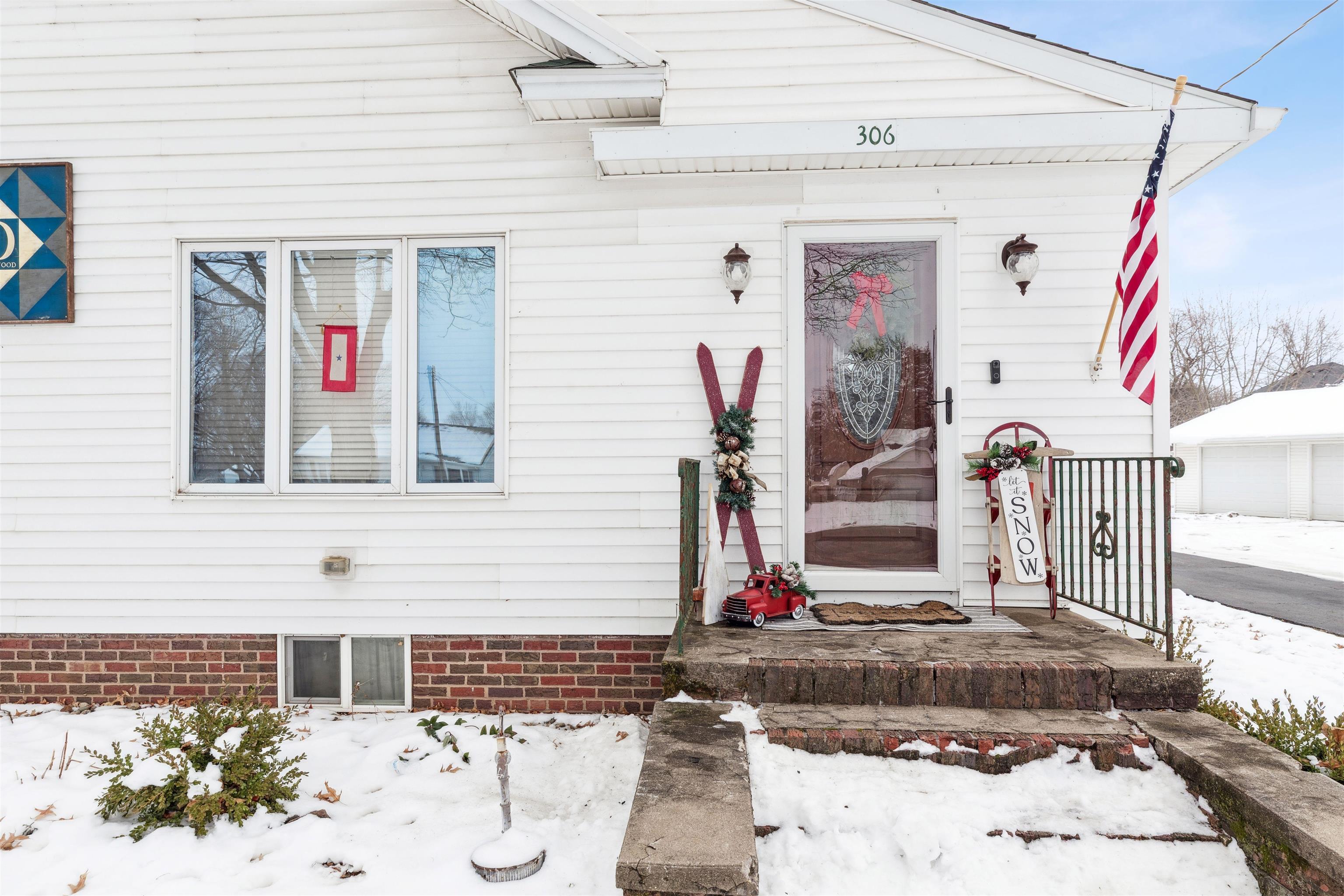 306 North Main Street Alexis, IL 61412 - Photo 8 of 44 a front view of a house with entryway