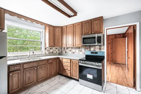 a view of an empty room with a window