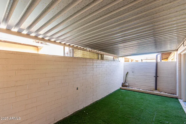 a view of a backyard with wooden floor and a cabin