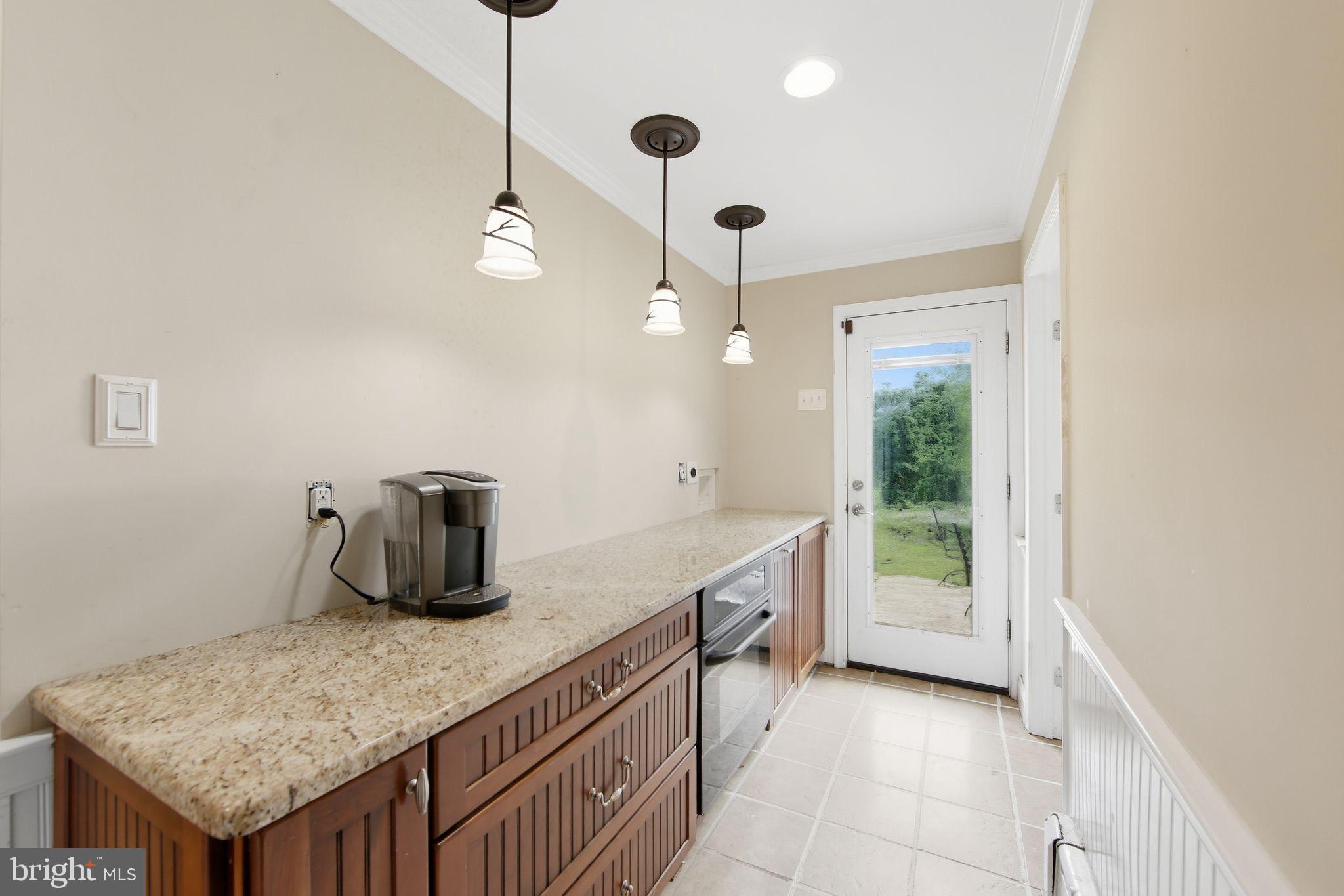 156 Grove Road Elverson, PA 19520 - Photo 11 of 45 a kitchen with stainless steel appliances granite countertop a sink a oven a counter space and cabinets
