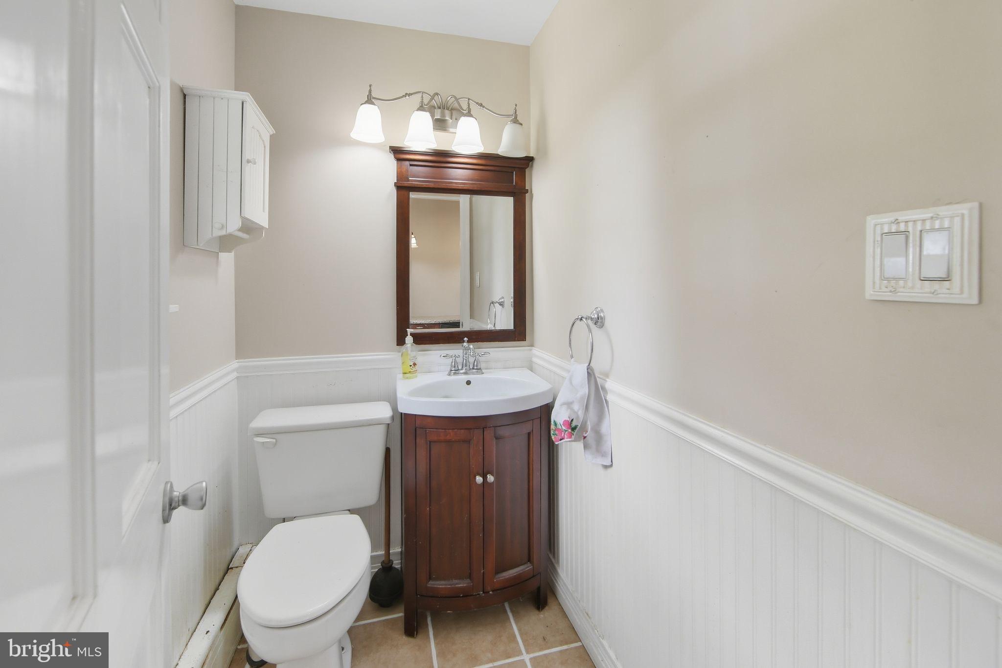 156 Grove Road Elverson, PA 19520 - Photo 14 of 45 a bathroom with a sink toilet and mirror