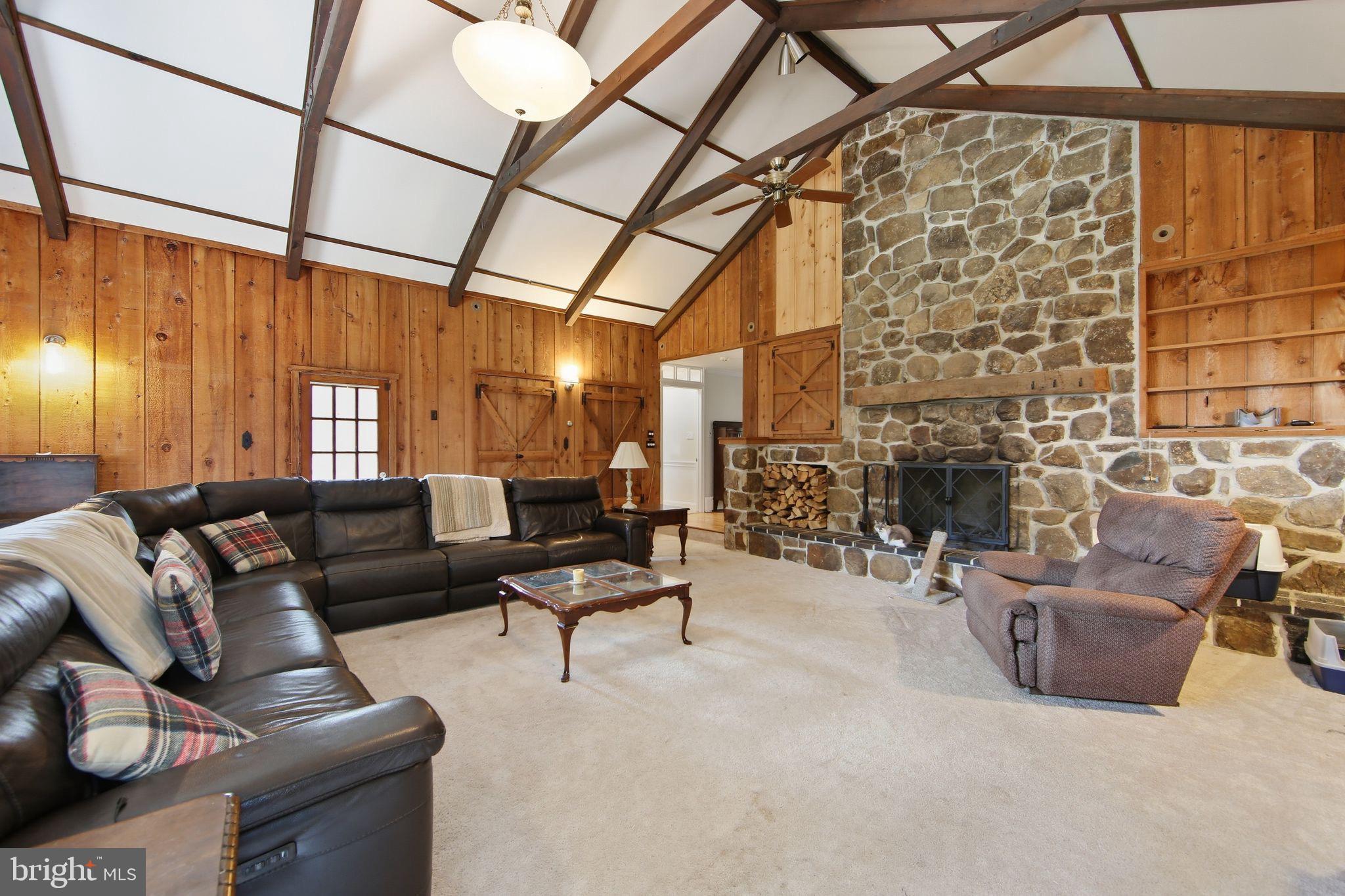 156 Grove Road Elverson, PA 19520 - Photo 16 of 45 a living room with furniture and a fireplace