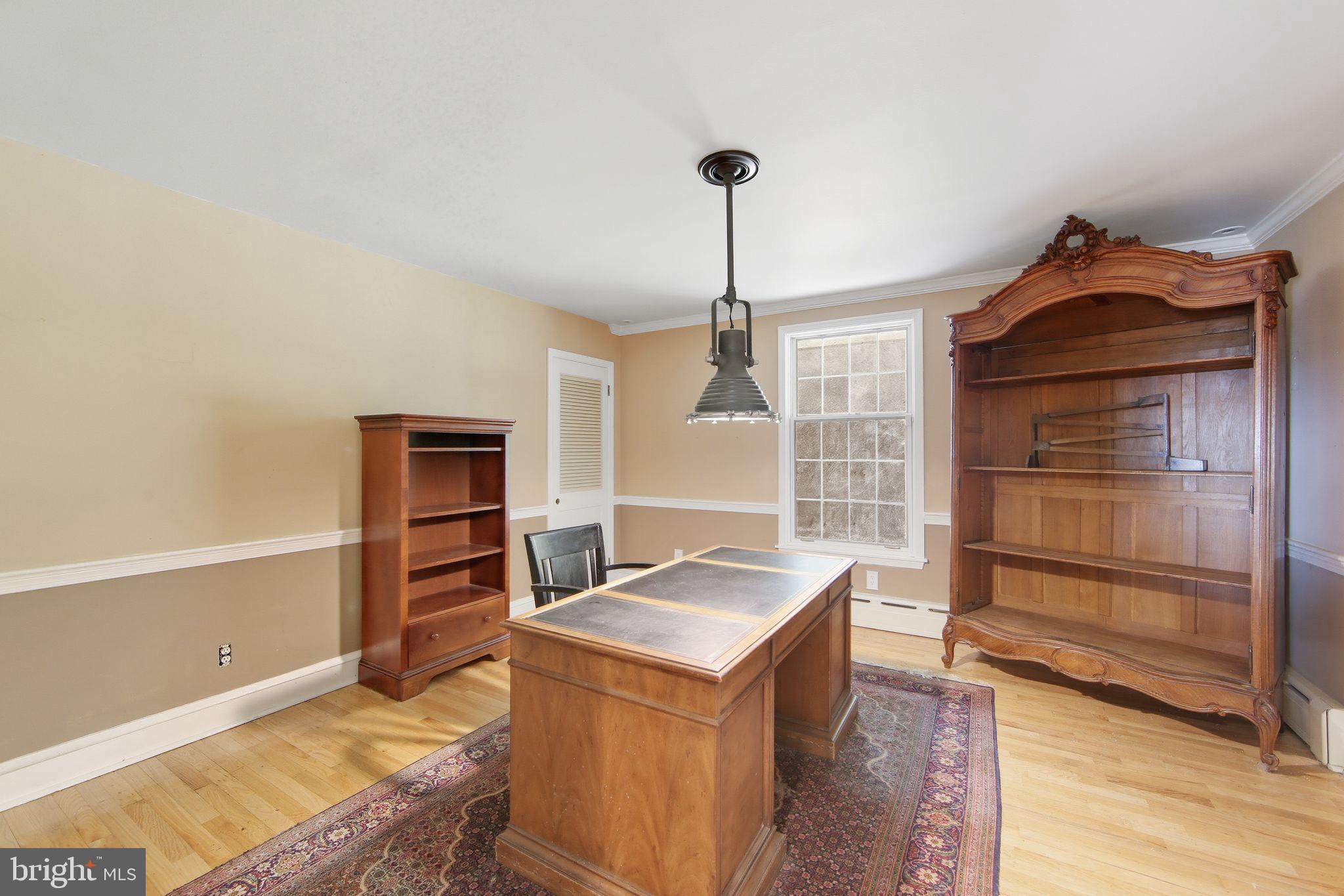 156 Grove Road Elverson, PA 19520 - Photo 18 of 45 a living room with hard wood floors and a fireplace