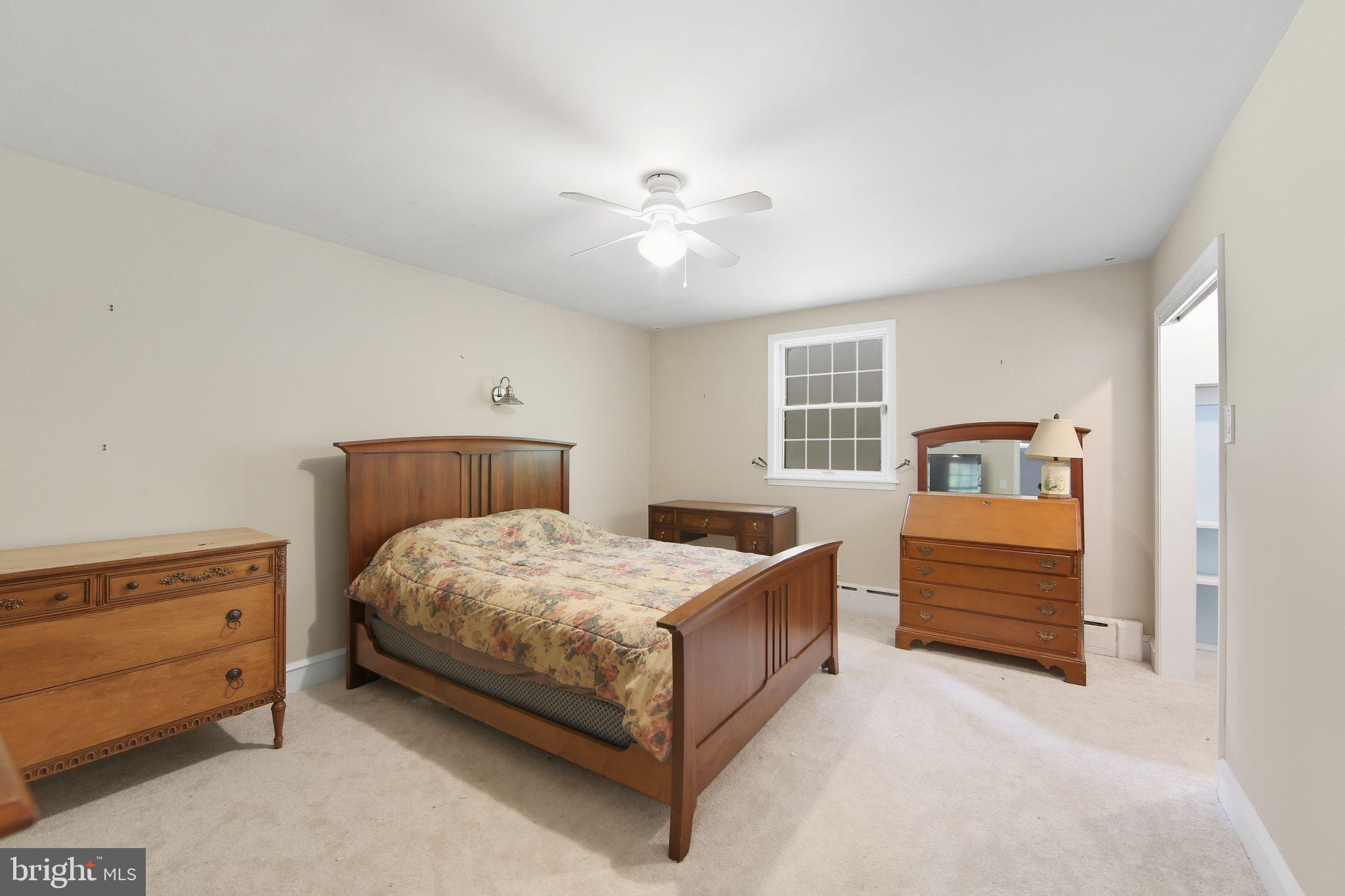156 Grove Road Elverson, PA 19520 - Photo 20 of 45 a bedroom with a bed and a dresser