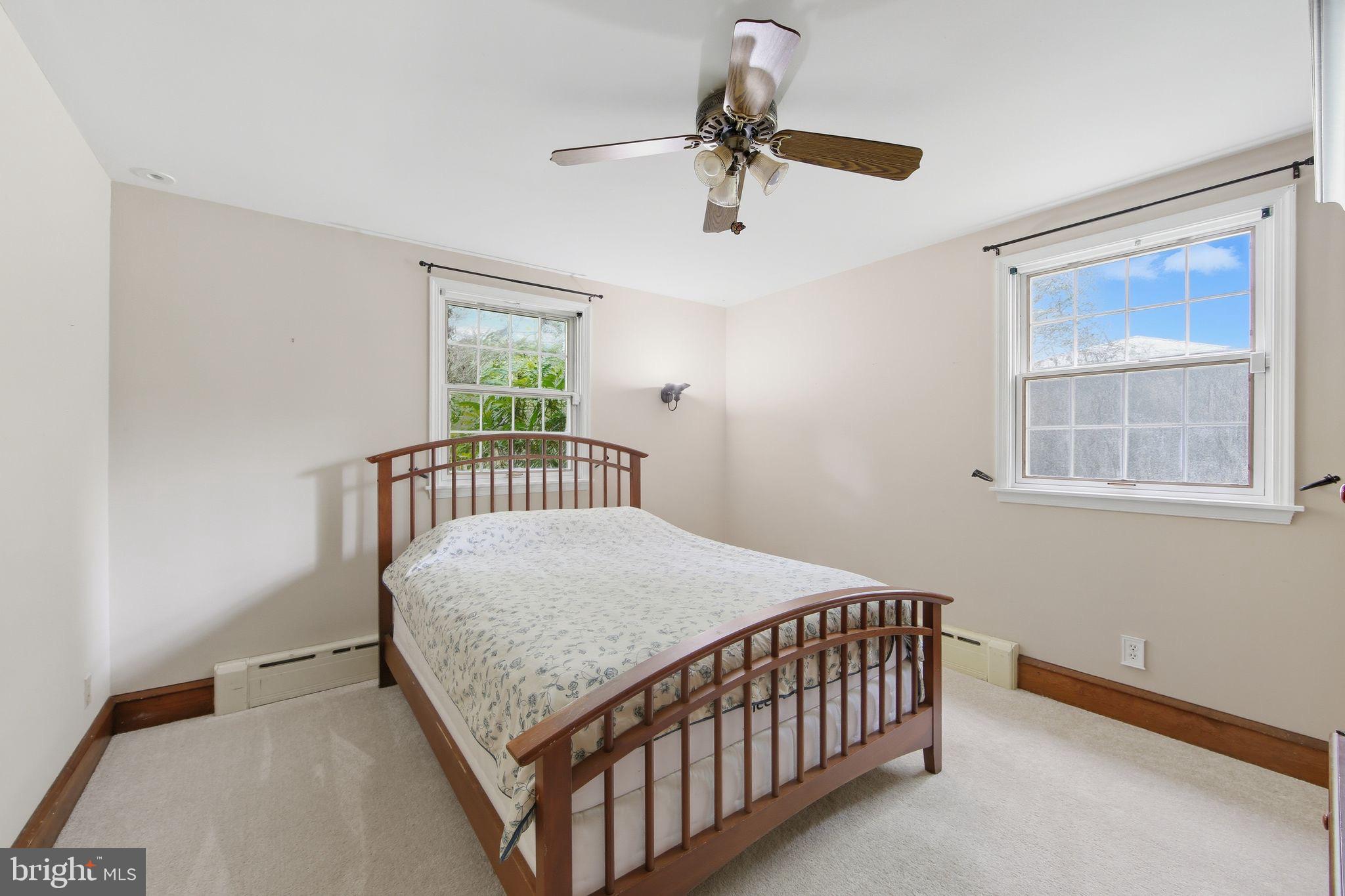 156 Grove Road Elverson, PA 19520 - Photo 21 of 45 a bedroom with a bed and window