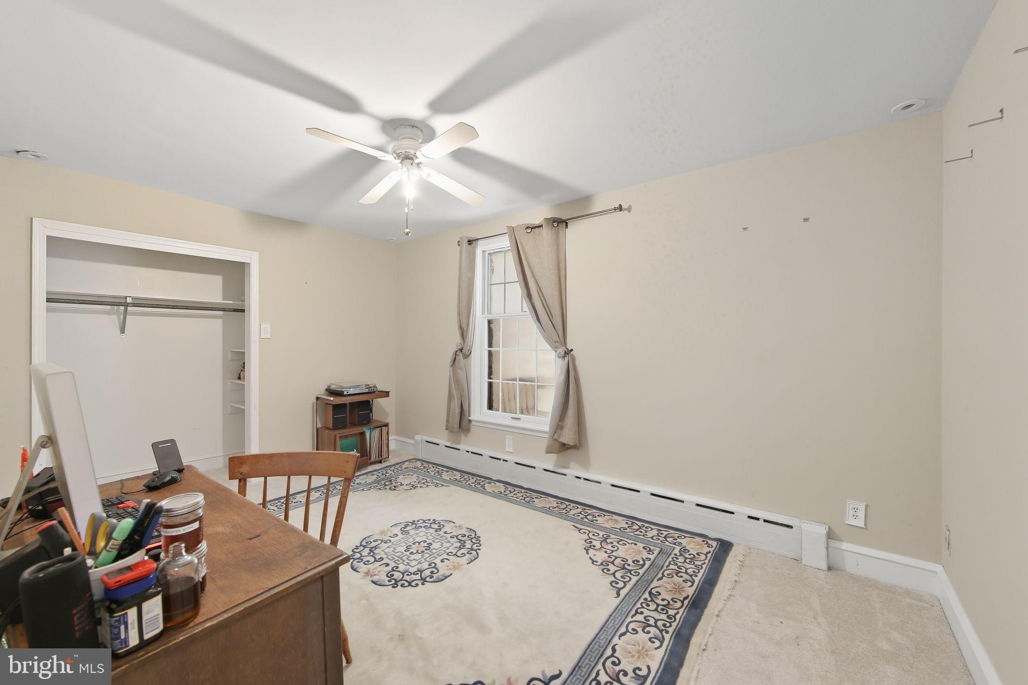 156 Grove Road Elverson, PA 19520 - Photo 24 of 45 a living room with furniture and a rug