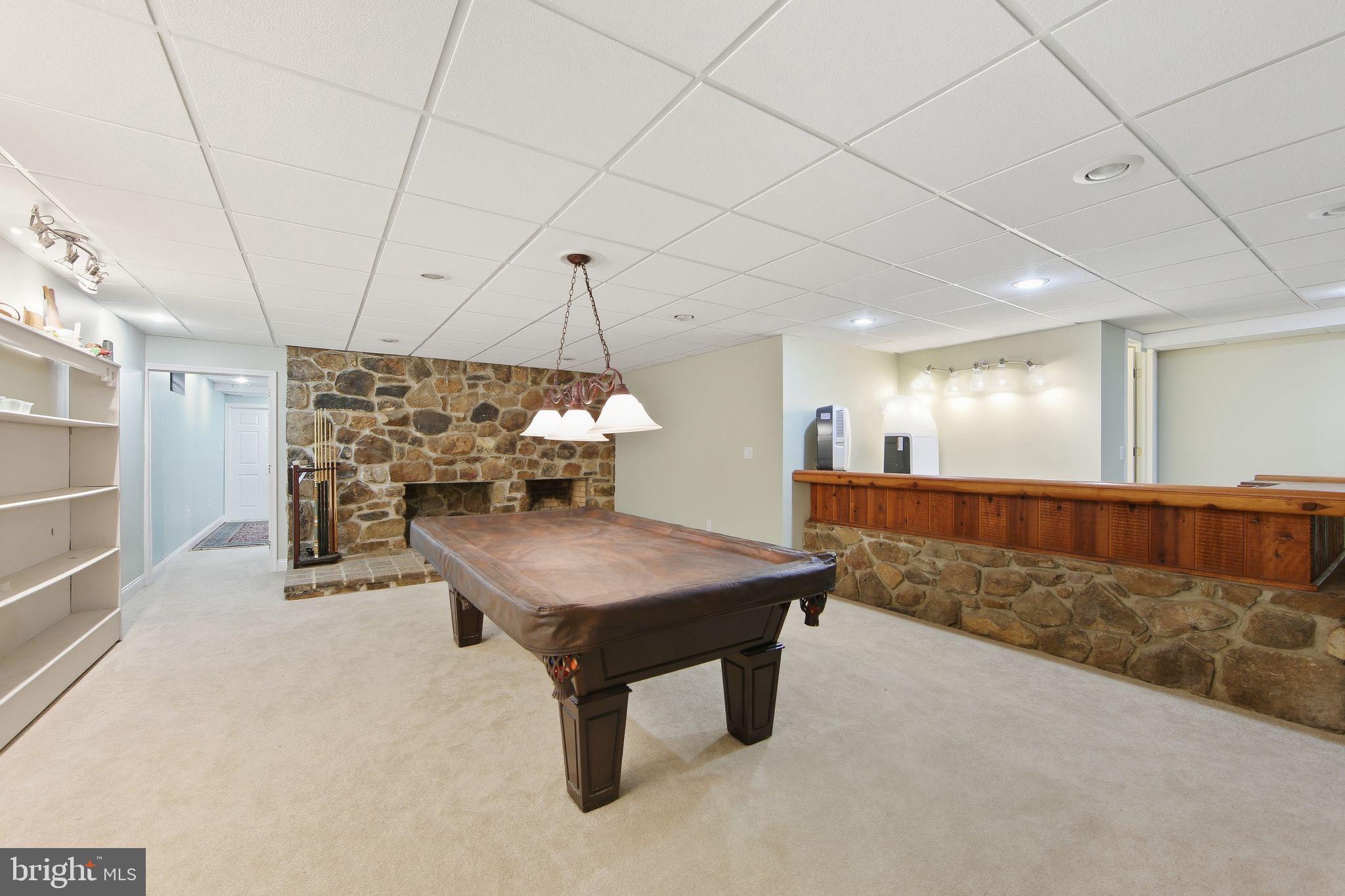156 Grove Road Elverson, PA 19520 - Photo 27 of 45 a room with lots of furniture and a chandelier