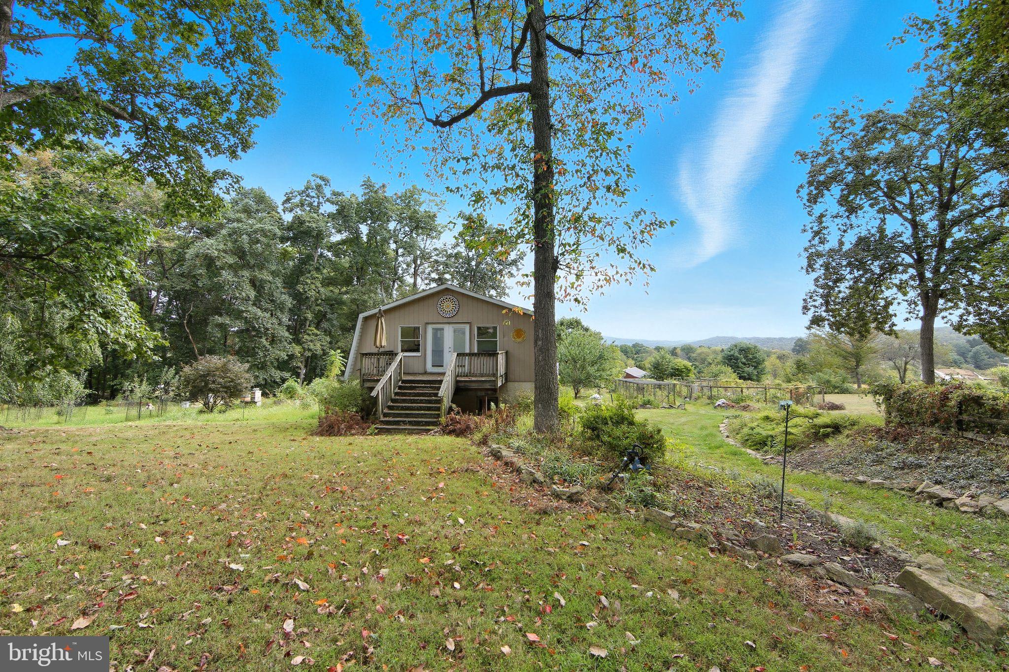 156 Grove Road Elverson, PA 19520 - Photo 33 of 45 a yellow house with trees in the background