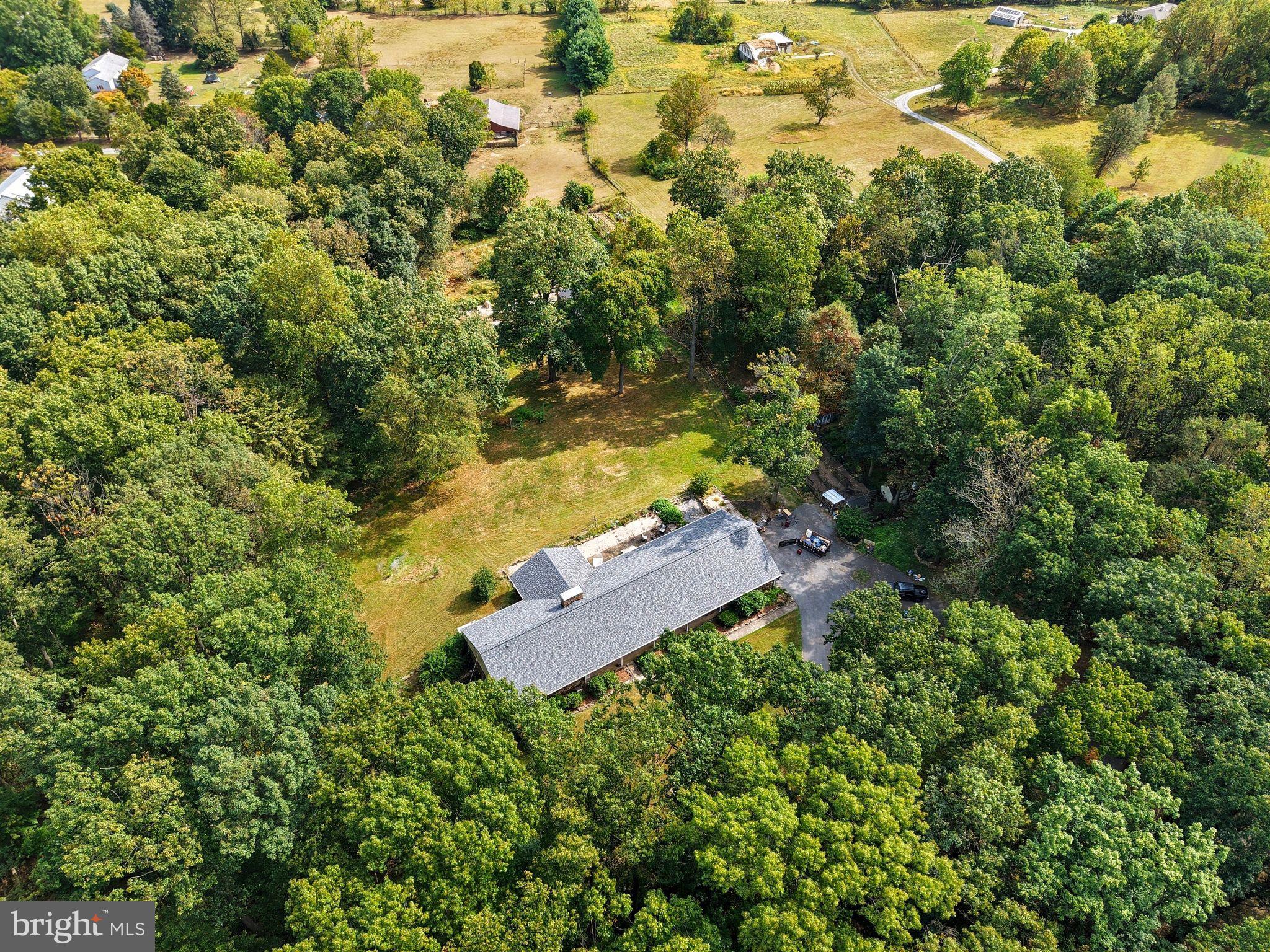 156 Grove Road Elverson, PA 19520 - Photo 40 of 45 an aerial view of residential house with yard and swimming pool