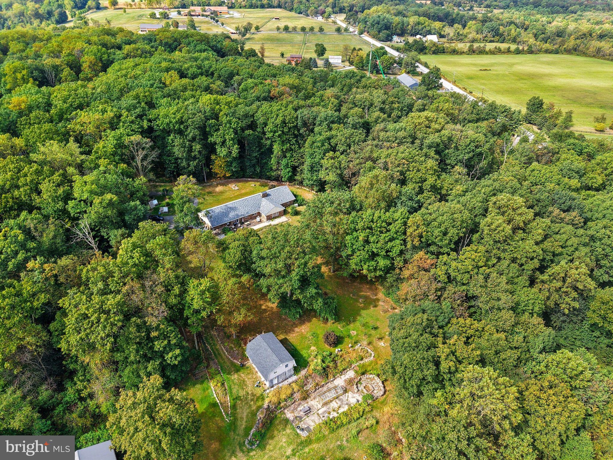 156 Grove Road Elverson, PA 19520 - Photo 43 of 45 an aerial view of residential house with outdoor space and trees around