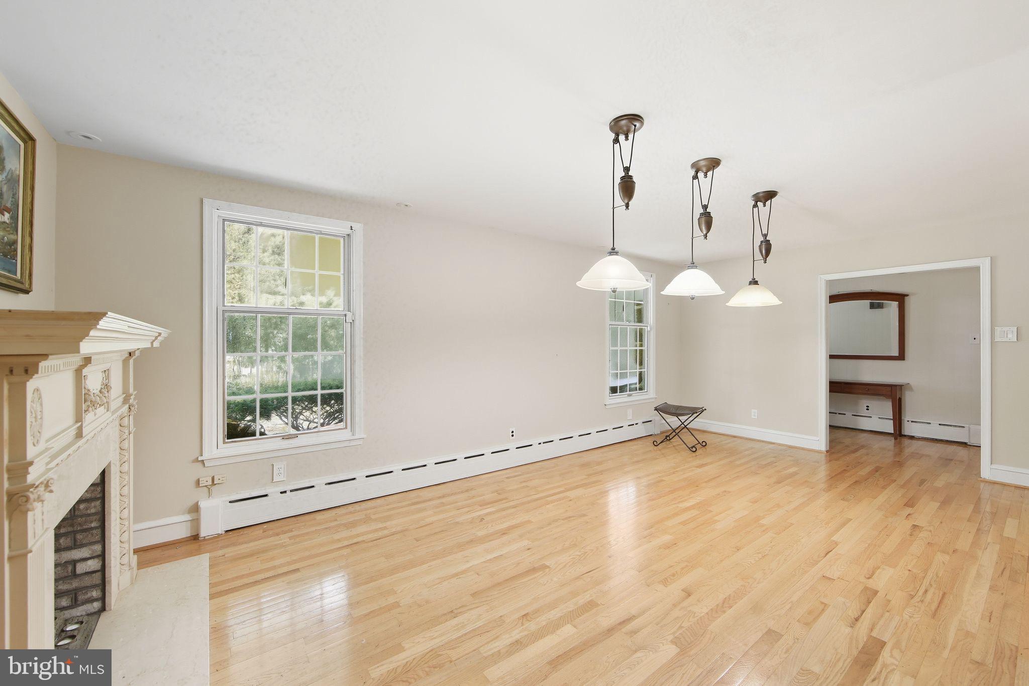 156 Grove Road Elverson, PA 19520 - Photo 10 of 45 a view of empty room with wooden floor and fan