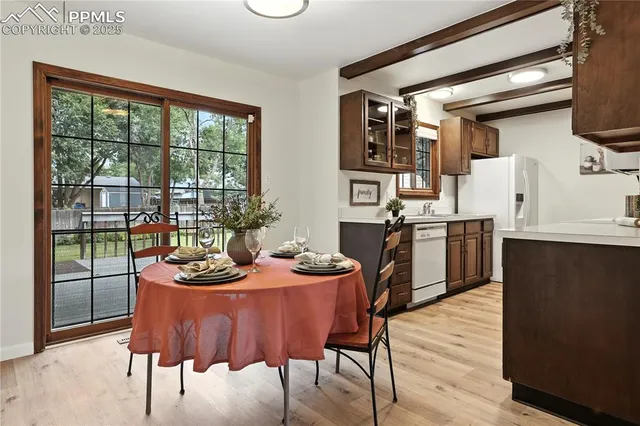 a dining room with furniture and window