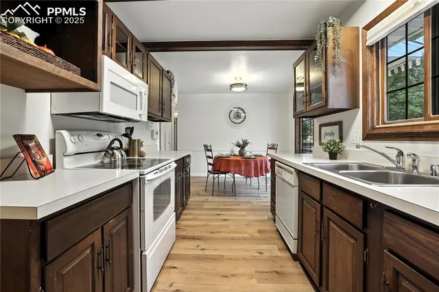 a kitchen with stainless steel appliances granite countertop lots of counter top space