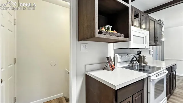 a kitchen with a sink a stove and refrigerator