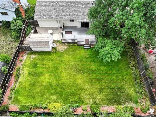 a view of a patio with table and chairs and potted plants
