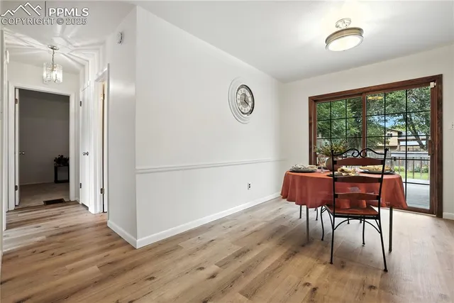 a workspace with furniture window and wooden floor