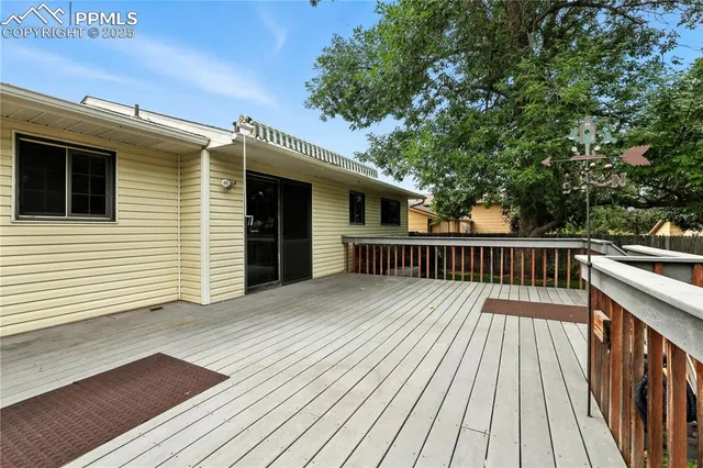 a view of deck with wooden floor and fence