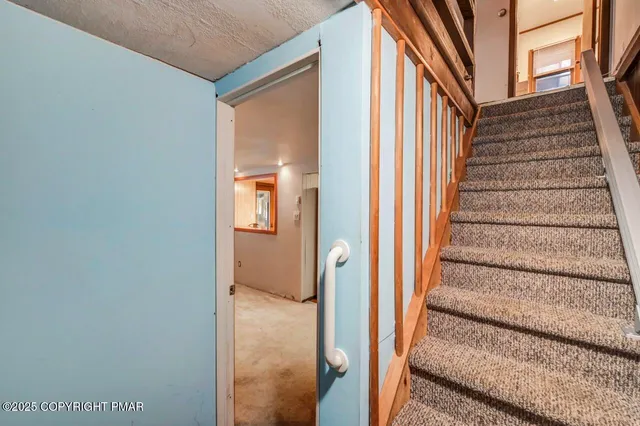 a bathroom with a sink mirror and toilet