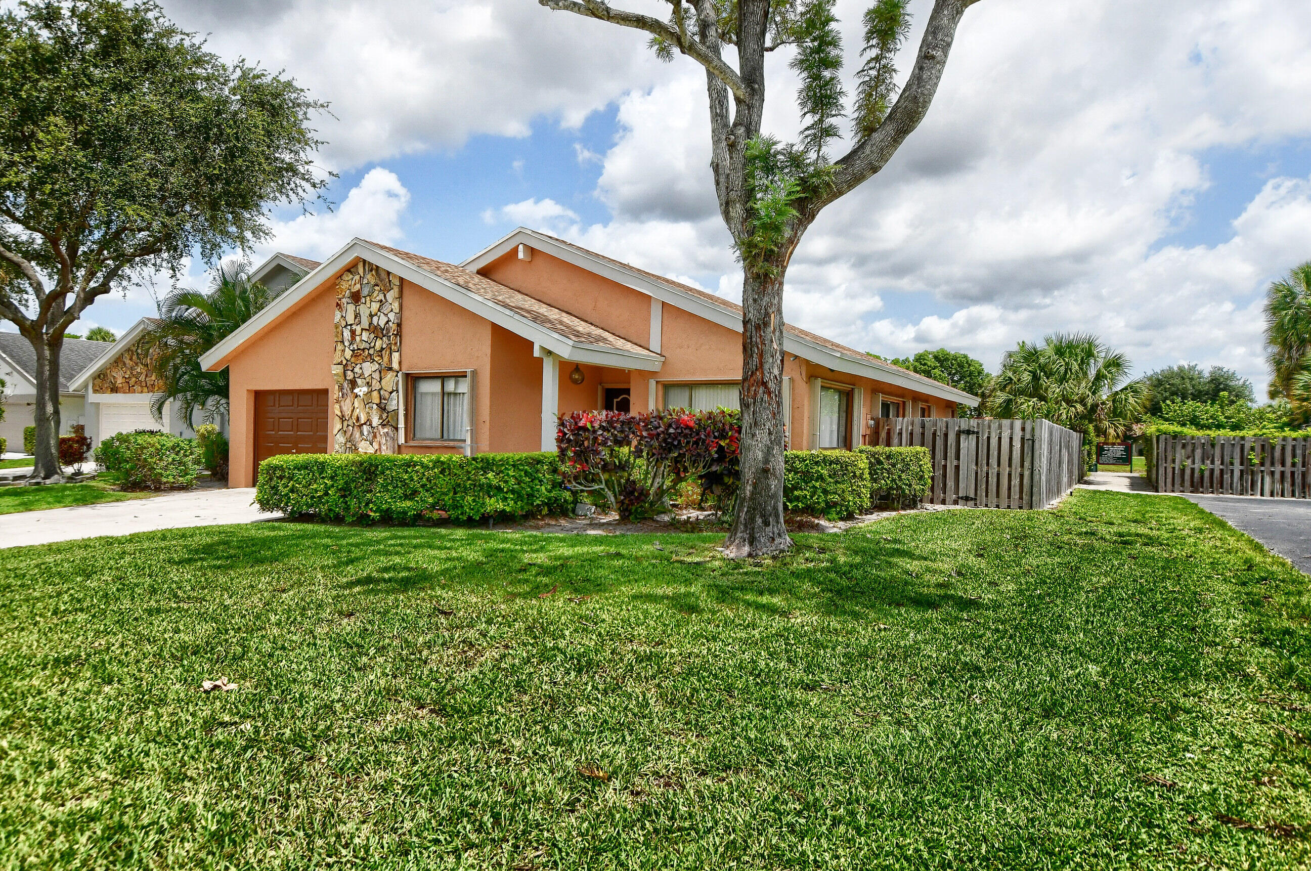 7521 Martinique Boulevard Boca Raton, FL 33433 - Photo 3 of 11 Front View with path to lake