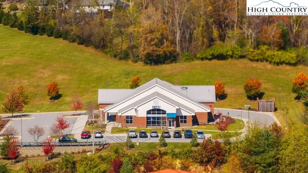 an aerial view of a house with a ocean view