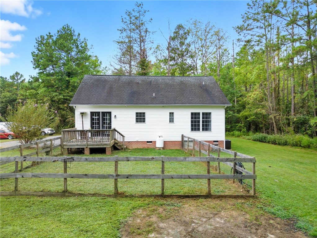 878 Salvia Road Newtown, VA 23126 - Photo 26 of 33 Rear view of house featuring a yard, crawl space, a wooden deck, and a shingled roof
