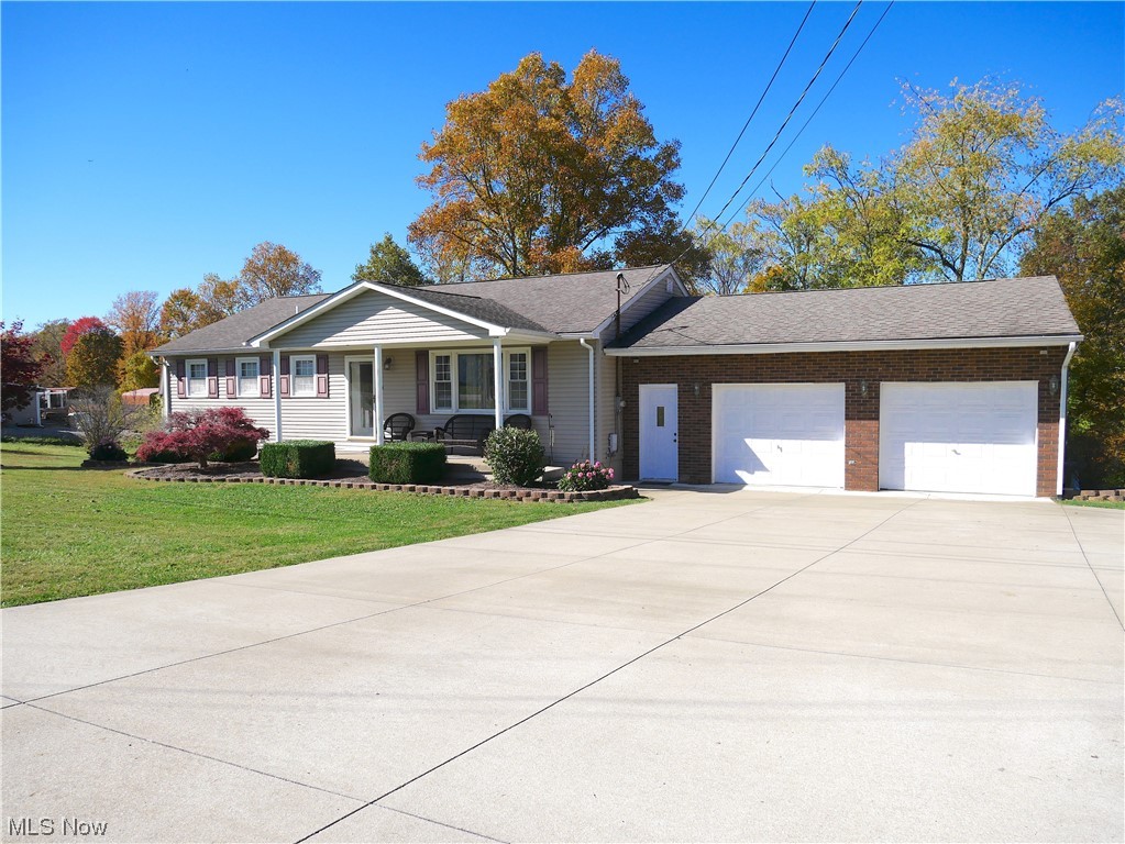 62818 Chestnut Road Bellaire, OH 43906 - Photo 1 of 18 Single story home featuring a garage and a front lawn