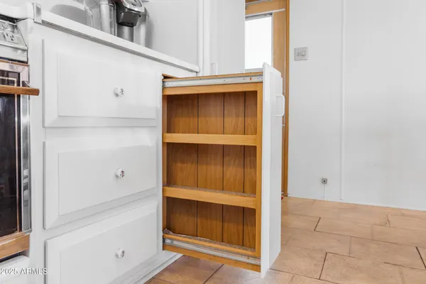 a kitchen with stainless steel appliances granite countertop a refrigerator sink and stove