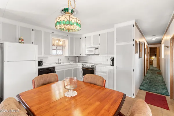 a view of a bathroom with sink and shower