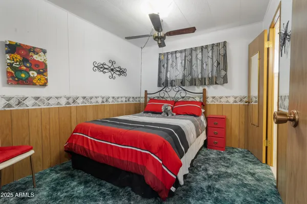 a bedroom with a bed and closet