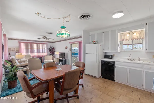 a view of a dining room with furniture and window