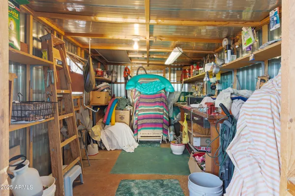 a view of a patio with a table and chairs