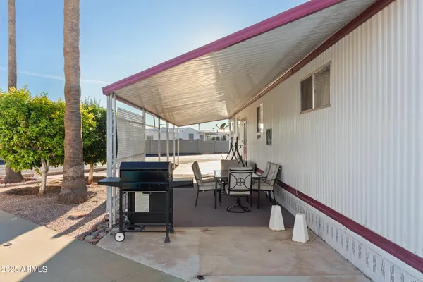 a view of a palm trees front of house