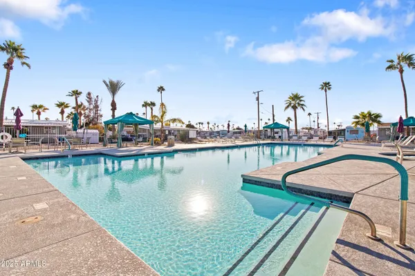 a view of swimming pool with outdoor seating