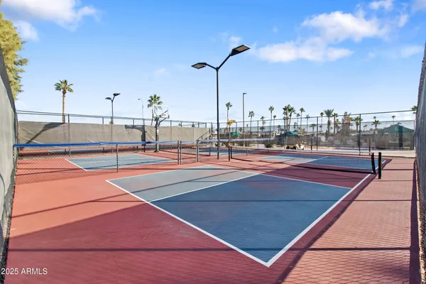 a view of the patio with a table and chairs and potted plants