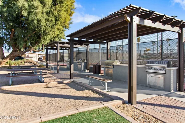 a swimming pool with outdoor seating and city view