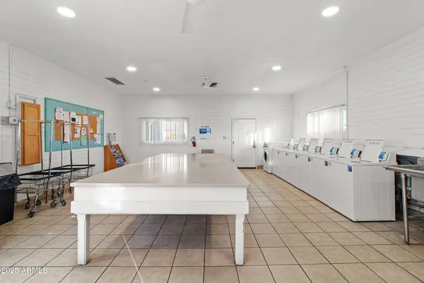 a living room with kitchen appliances and a fireplace