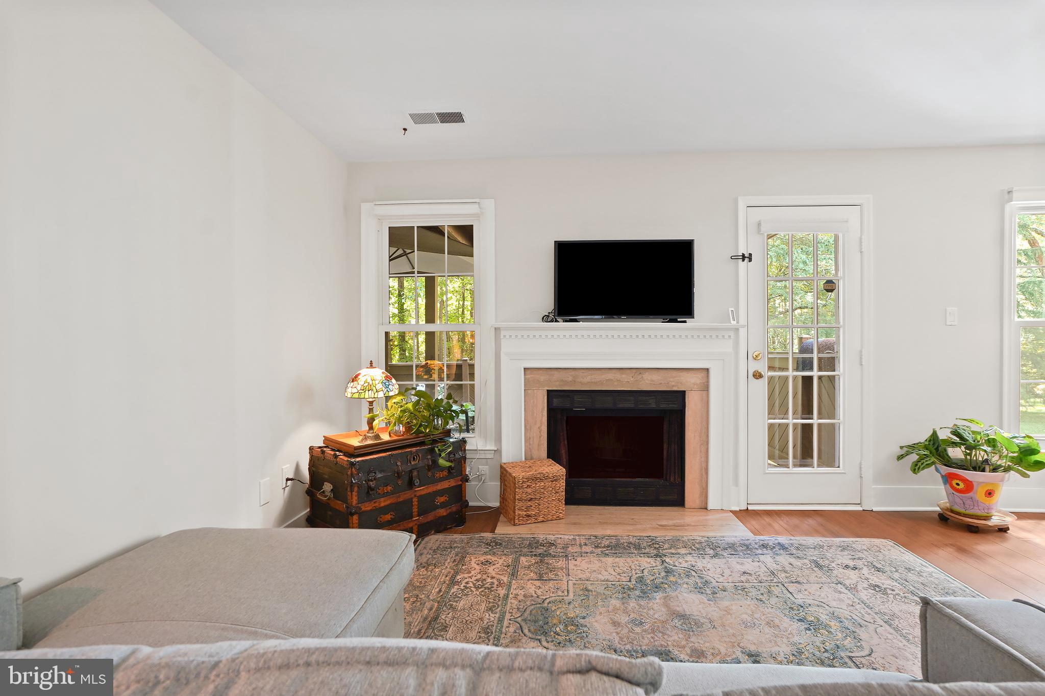 1515 Church Hill Place Reston, VA 20194 - Photo 13 of 28 Living room with fireplace and TV wall