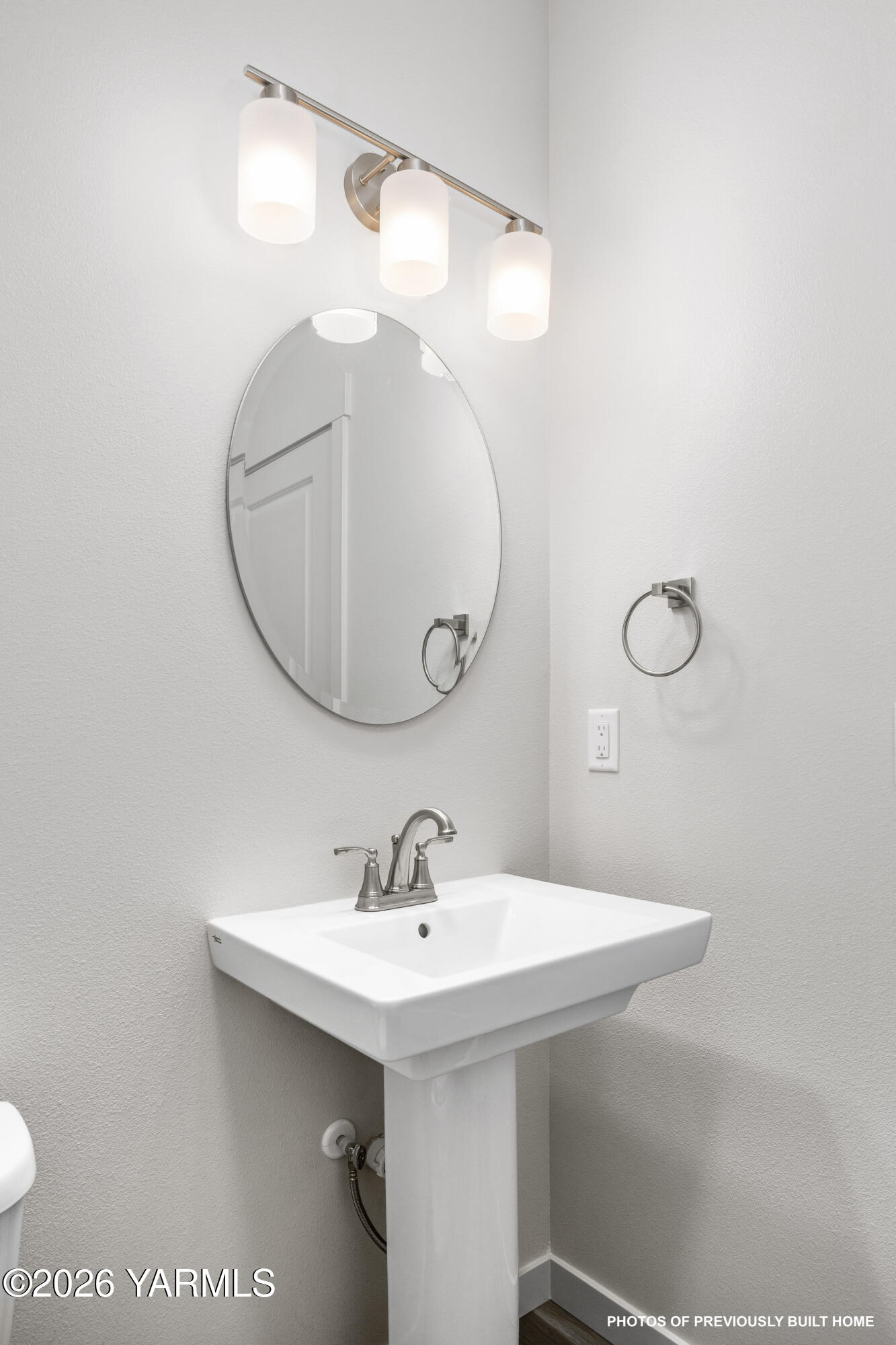 215 Packer Street Prosser, WA 99350 - Photo 8 of 45 a bathroom with a sink a mirror and a toilet