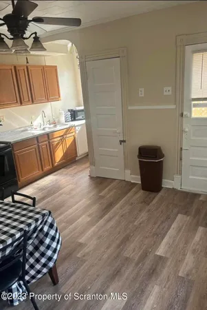 a living room with a couch and a rug
